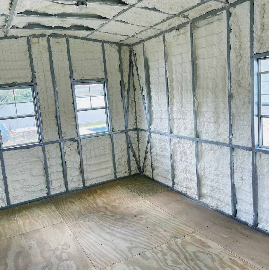 Closed-cell spray foam insulation applied to wall cavities in a residential project in Hugo